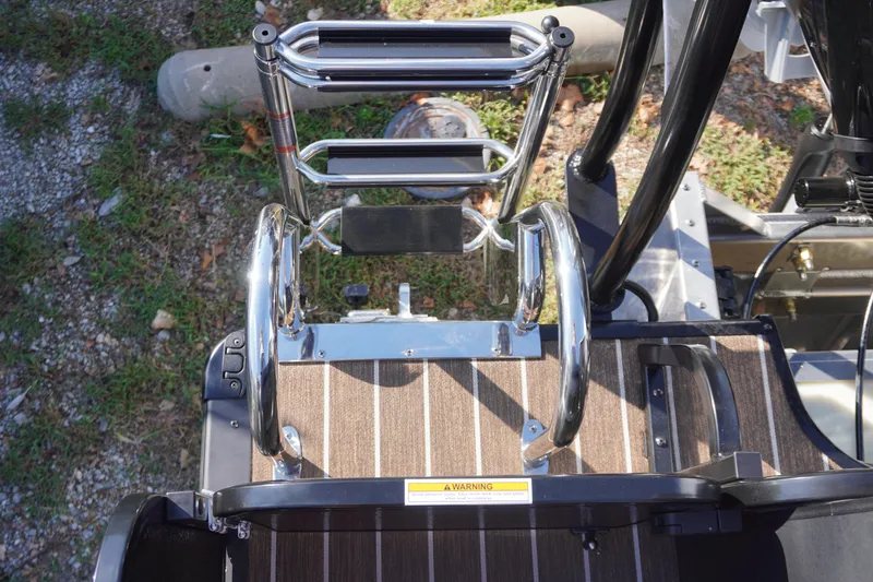 Slide: The Image of Interior of 2026 Premier 250 Solaris RS boat with striped flooring and seating. - 28