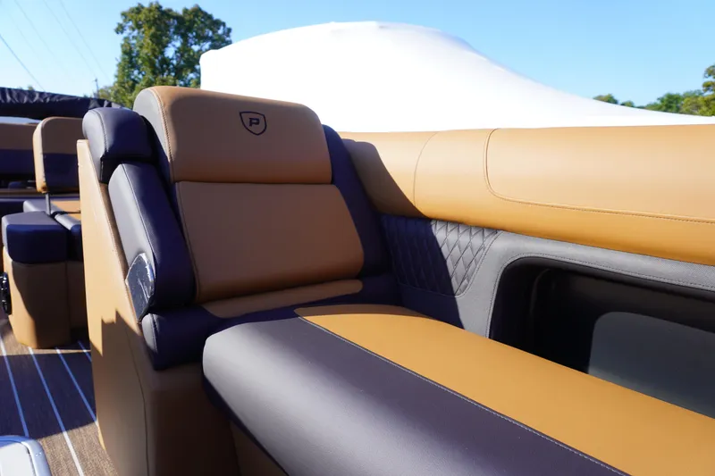 Slide: The Image of Luxurious seating on 2026 Premier 250 Solaris RS boat, featuring tan and black upholstery. - 6