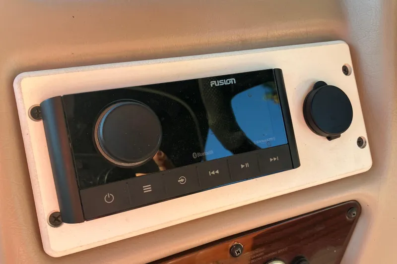 Slide: The Image of Fusion Bluetooth stereo system on 2000 Chaparral Sunesta 232 boat dashboard. - 13
