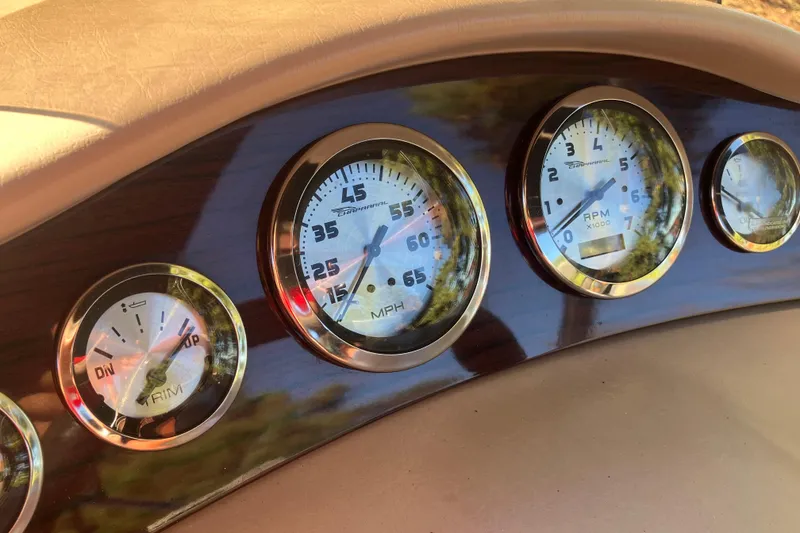 Slide: The Image of Dashboard gauges of a 2000 Chaparral Sunesta 232 boat, featuring speedometer and RPM indicators. - 15