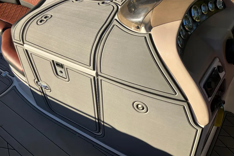 Slide: The Image of Control panel of a 2000 Chaparral Sunesta 232 boat, featuring sleek design and instrumentation. - 16