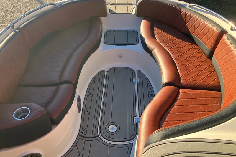 Slide: The Image of Luxurious interior of 2000 Chaparral Sunesta 232 boat with brown leather seating. - 17
