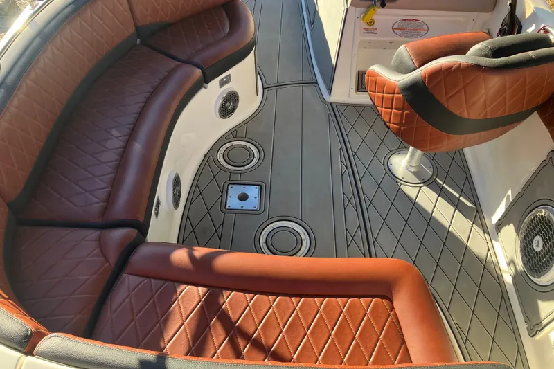Slide: The Image of Luxurious interior of 2000 Chaparral Sunesta 232 boat with diamond-stitched leather seating. - 9