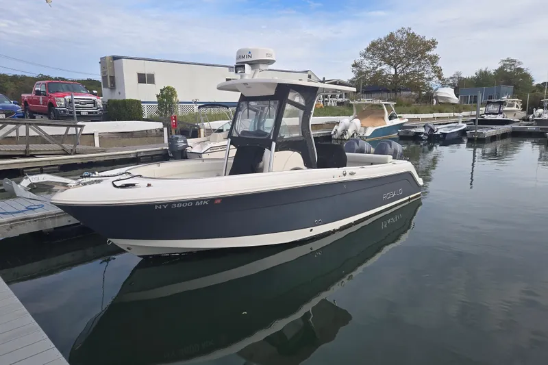 The Image of 2014 Robalo R240 Center Console boat docked at marina. - 0