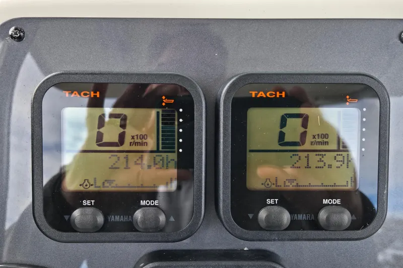 Slide: The Image of Tachometer display on 2014 Robalo R240 Center Console boat dashboard. - 12