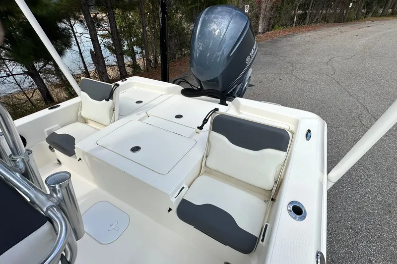 Slide: The Image of 2013 Skeeter SX240 boat interior with seating and Yamaha outboard motor. - 11