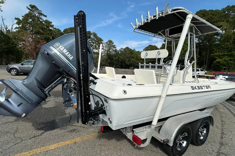Slide: The Image of 2013 Skeeter SX240 boat with Yamaha outboard motor on a trailer. - 4