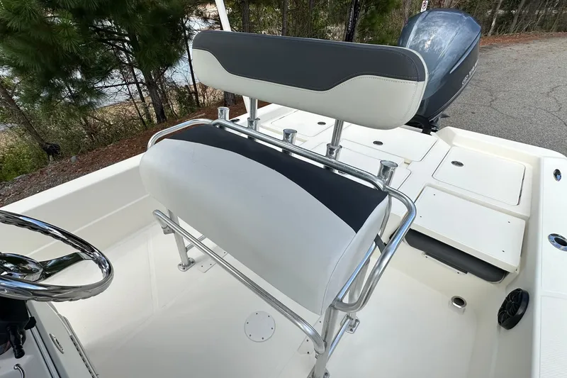 Slide: The Image of 2013 Skeeter SX240 boat interior with seating and steering wheel. - 9