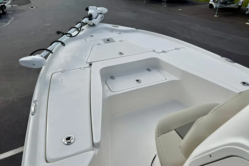 Slide: The Image of 2026 Key West 210 Bay Reef boat deck with storage compartments and seating. - 13