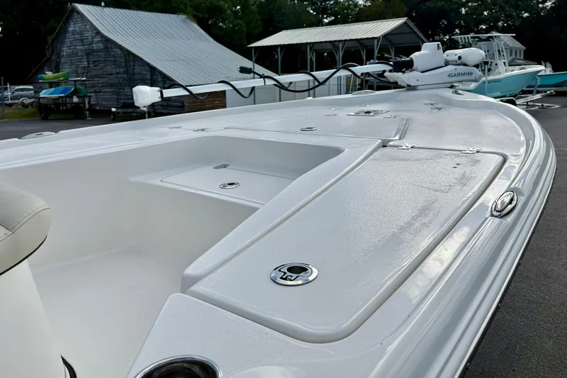 Slide: The Image of 2026 Key West 210 Bay Reef boat deck with storage compartments and Garmin equipment. - 15