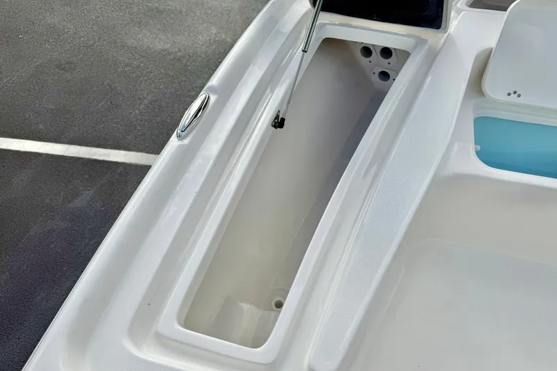 Slide: The Image of 2026 Key West 210 Bay Reef boat storage compartment detail. - 24