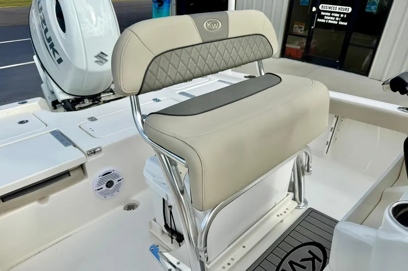 Slide: The Image of 2026 Key West 210 Bay Reef boat seat with Suzuki engine in background. - 31
