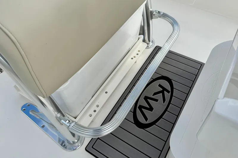 Slide: The Image of Key West 210 Bay Reef 2026 boat seat and KW-branded mat detail. - 32