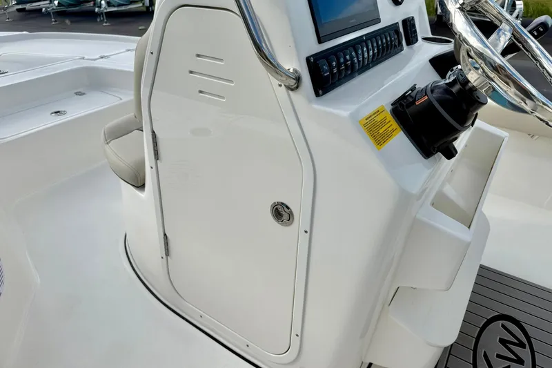Slide: The Image of 2026 Key West 210 Bay Reef boat console with steering wheel and control panel. - 34