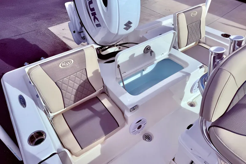 Slide: The Image of 2026 Key West 210 Bay Reef boat interior with seating and storage compartments. - 44