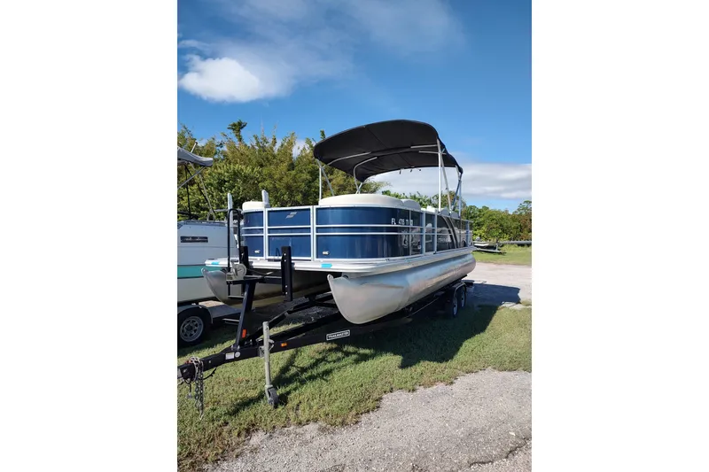 Slide: The Image of 2016 Starcraft CX 23 FD boat interior with curved seating and table. - 10