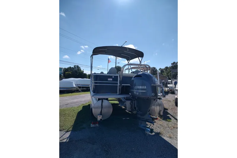 Slide: The Image of 2016 Starcraft CX 23 FD pontoon boat with Yamaha 150 engine on trailer. - 11