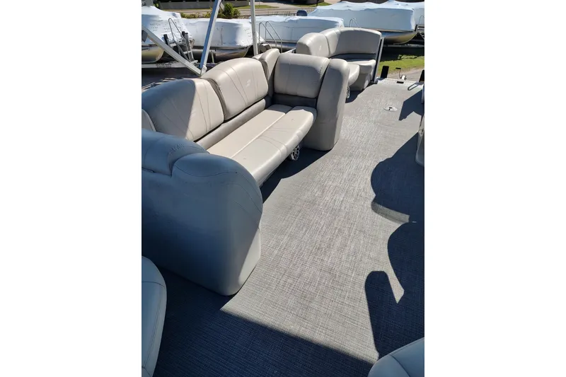 Slide: The Image of 2016 Starcraft CX 23 FD boat interior with two plush captain chairs. - 6