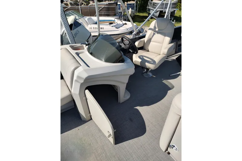 Slide: The Image of 2016 Starcraft CX 23 FD pontoon boat with Yamaha motor on trailer, parked outdoors. - 7