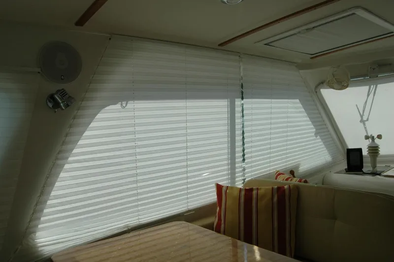 Slide: The Image of Interior of 2014 Back Cove 34 yacht with blinds and striped cushions. - 102