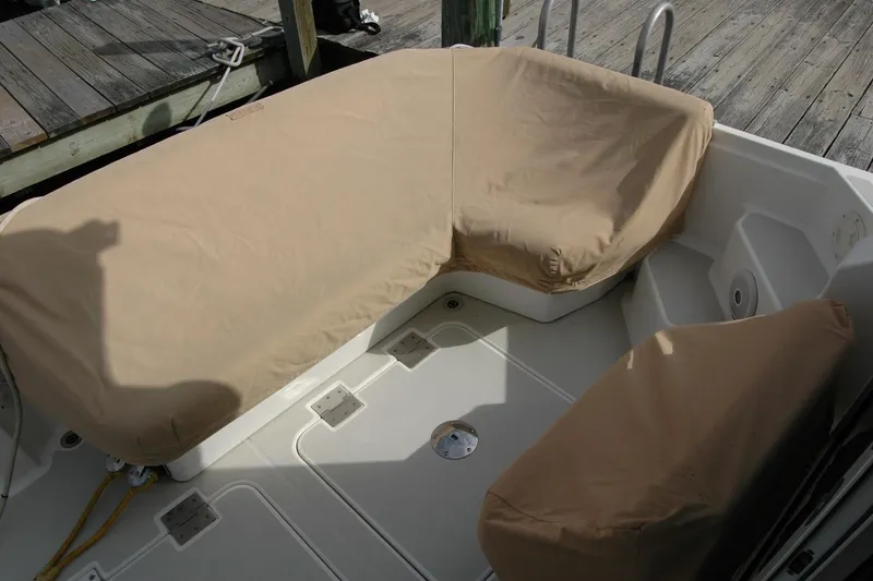 Slide: The Image of 2014 Back Cove 34 boat with covered seating area on deck. - 104