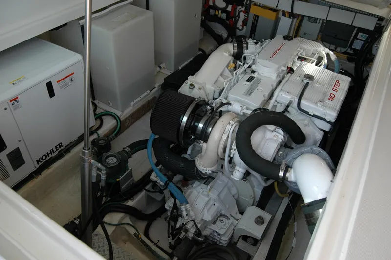 Slide: The Image of Engine room of 2014 Back Cove 34 boat with Cummins engine and Kohler generator. - 106