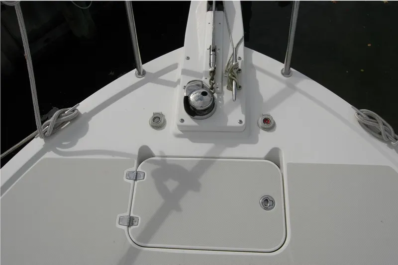 Slide: The Image of Bow deck of 2014 Back Cove 34 boat with anchor winch and storage hatch. - 38