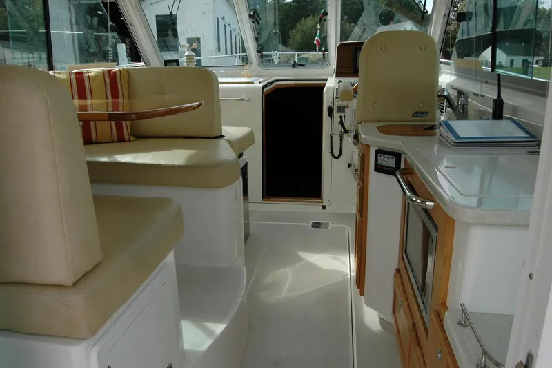 Slide: The Image of Interior of a 2014 Back Cove 34 boat with seating and kitchenette. - 48