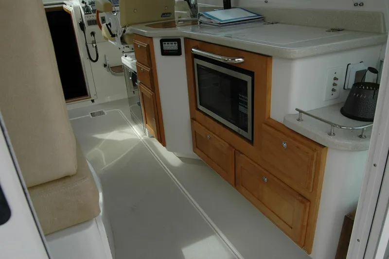 Slide: The Image of Interior of 2014 Back Cove 34 yacht with kitchen area and microwave. - 49