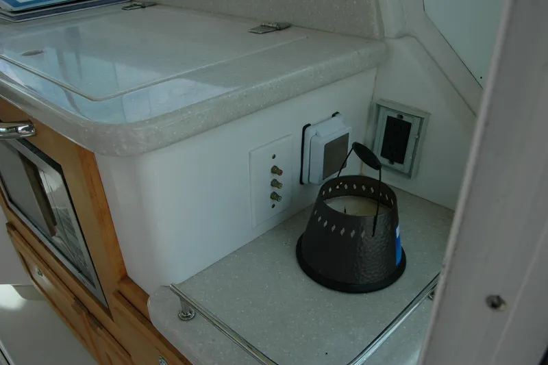 Slide: The Image of Interior of a 2014 Back Cove 34 boat showing a countertop with a candle holder. - 50
