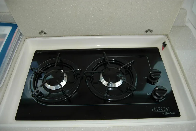 Slide: The Image of Gas stove in 2014 Back Cove 34 yacht kitchen, featuring two burners and sleek design. - 51