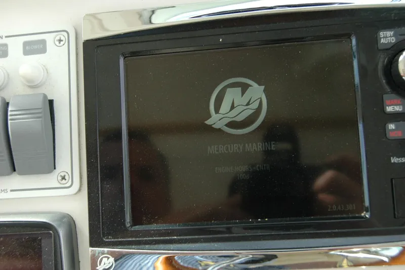 Slide: The Image of Control panel of a 2014 Back Cove 34 boat with Mercury Marine display. - 56