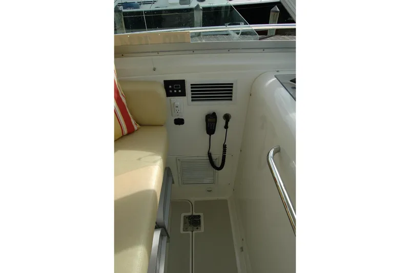 Slide: The Image of Interior of 2014 Back Cove 34 boat showing seating and control panel. - 62