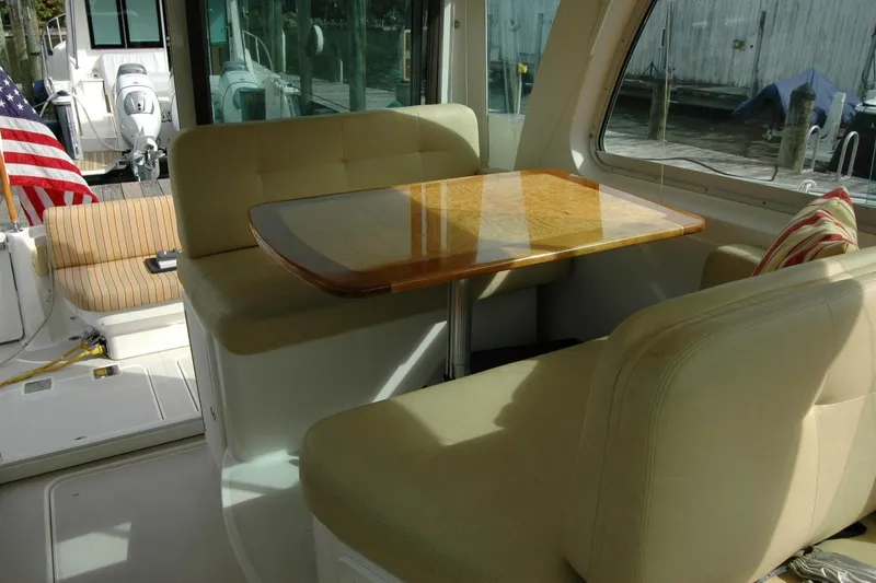 Slide: The Image of Interior of 2014 Back Cove 34 boat with seating and wooden table. - 64