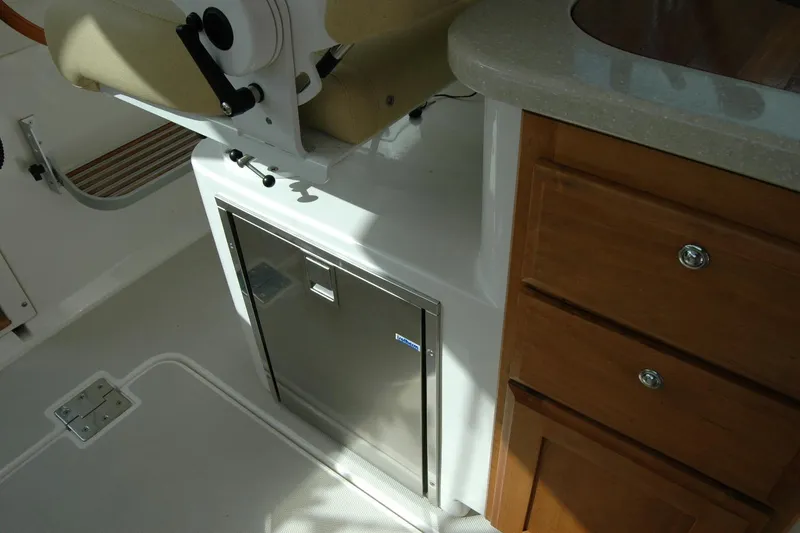 Slide: The Image of Interior of 2014 Back Cove 34 boat with seating and cabinetry. - 70