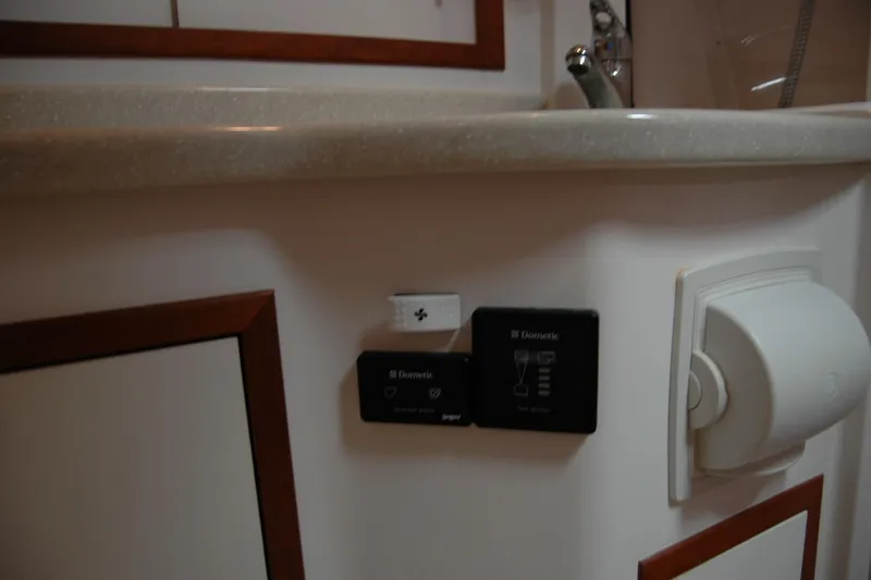 Slide: The Image of Control panel and outlet in 2014 Back Cove 34 boat interior. - 99