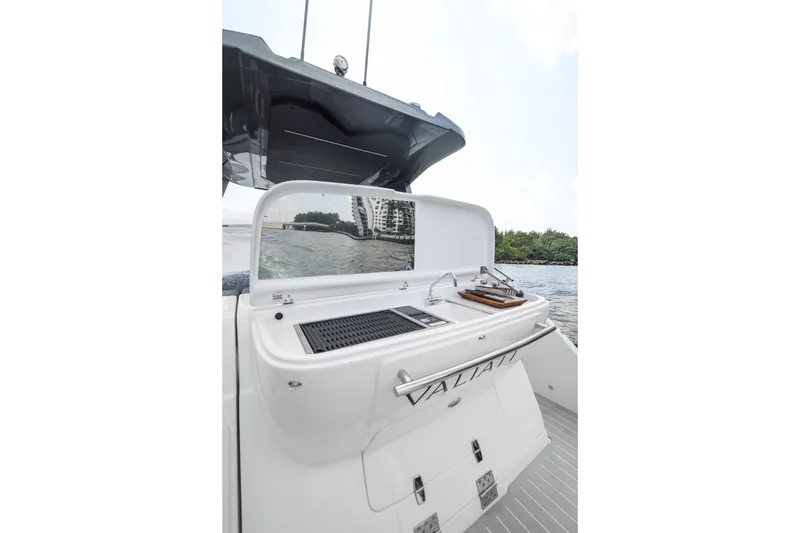 Slide: The Image of 2025 Valiatt 350GT yacht with outdoor kitchen and scenic water view. - 9