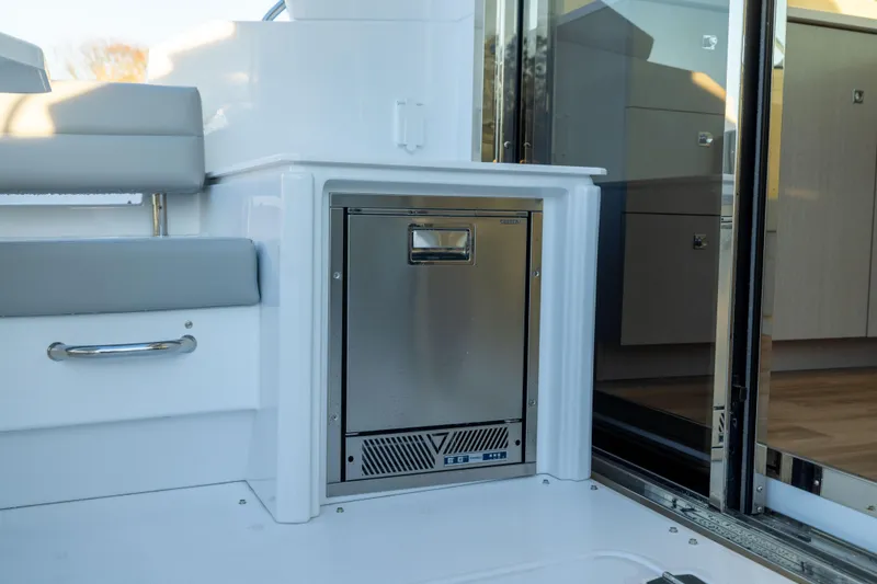 Slide: The Image of 2026 Cruisers Yachts 46 Cantius interior with stainless steel appliance and modern design. - 15