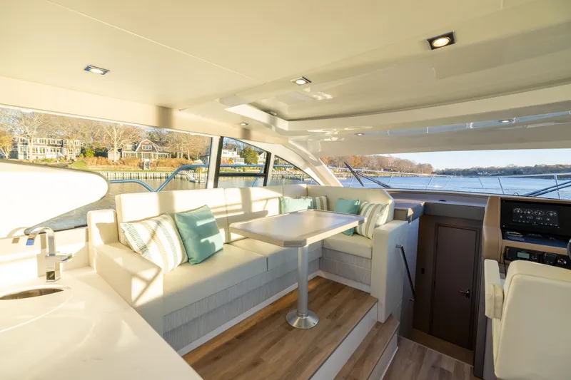 Slide: The Image of Luxurious interior of 2026 Cruisers Yachts 46 Cantius with elegant seating and scenic views. - 23