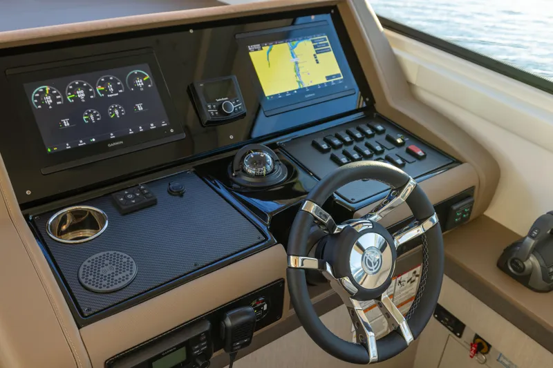Slide: The Image of Helm of 2026 Cruisers Yachts 46 Cantius with advanced navigation displays and controls. - 26