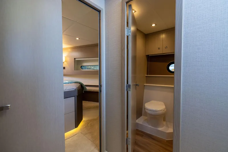 Slide: The Image of Luxurious interior of 2026 Cruisers Yachts 46 Cantius, featuring bedroom and bathroom. - 29