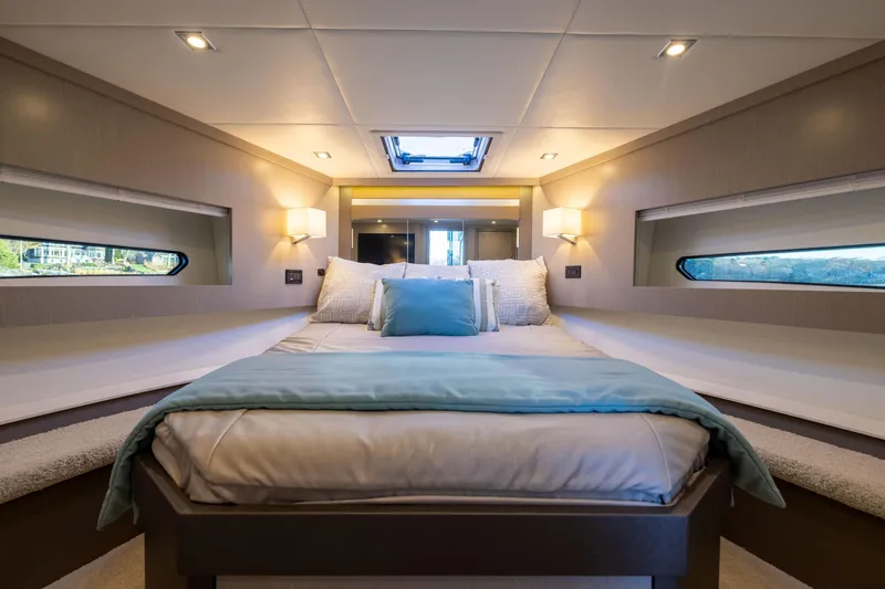 Slide: The Image of Luxurious bedroom interior of 2026 Cruisers Yachts 46 Cantius with elegant bedding. - 34