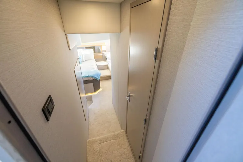 Slide: The Image of Interior hallway of 2026 Cruisers Yachts 46 Cantius, leading to a cozy bedroom. - 38