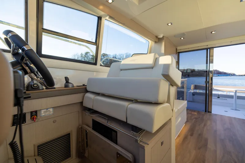Slide: The Image of Interior of 2026 Cruisers Yachts 46 Cantius with modern helm and seating. - 48