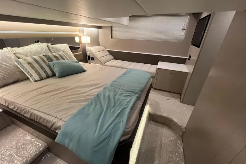 Slide: The Image of 2026 Cruisers Yachts 46 Cantius on serene water at sunset. - 6