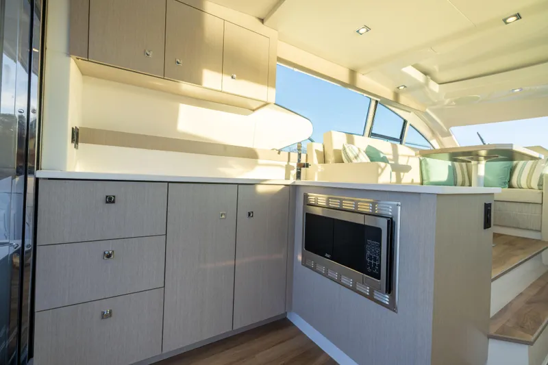 Slide: The Image of Luxurious interior of 2026 Cruisers Yachts 46 Cantius with modern kitchen amenities. - 20
