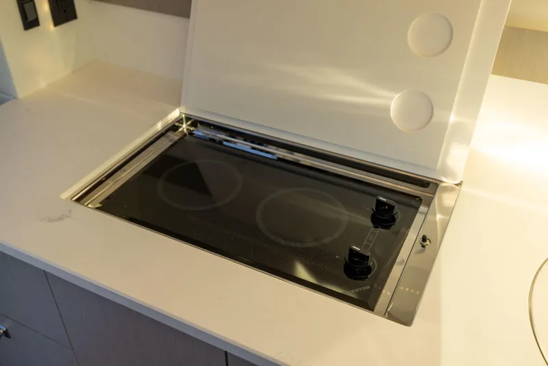 Slide: The Image of Built-in stovetop on 2026 Cruisers Yachts 46 Cantius, featuring sleek modern design. - 21