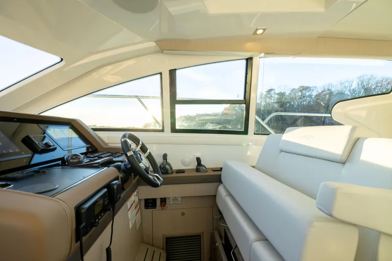 Slide: The Image of Interior of 2026 Cruisers Yachts 46 Cantius, featuring modern helm and seating. - 24