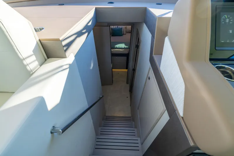Slide: The Image of Interior view of 2026 Cruisers Yachts 46 Cantius, showcasing modern staircase and cabin entrance. - 28