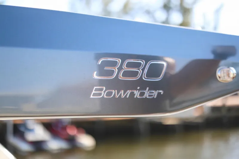 Slide: The Image of Close-up of 2025 VALIATT YACHTS 380 Bowrider logo on sleek blue surface. - 4